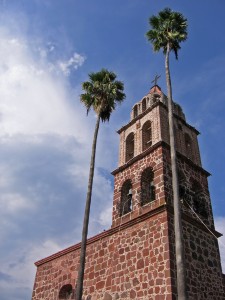 Church tower and palms