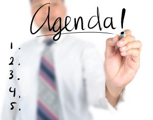 Businessman writing agenda